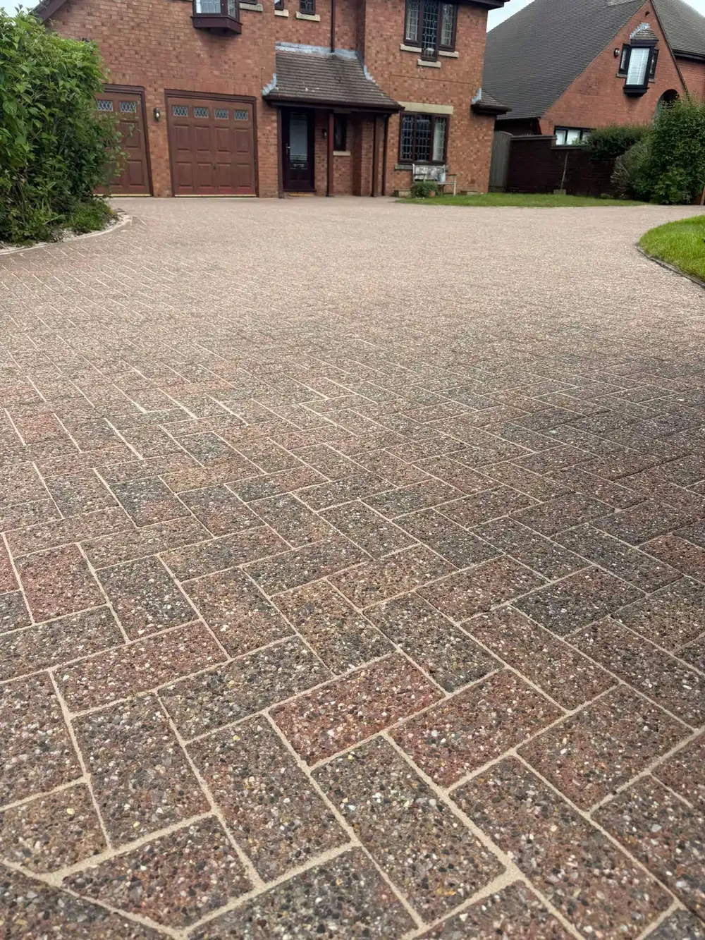 The same block driveway after pressure washing, block colour restored