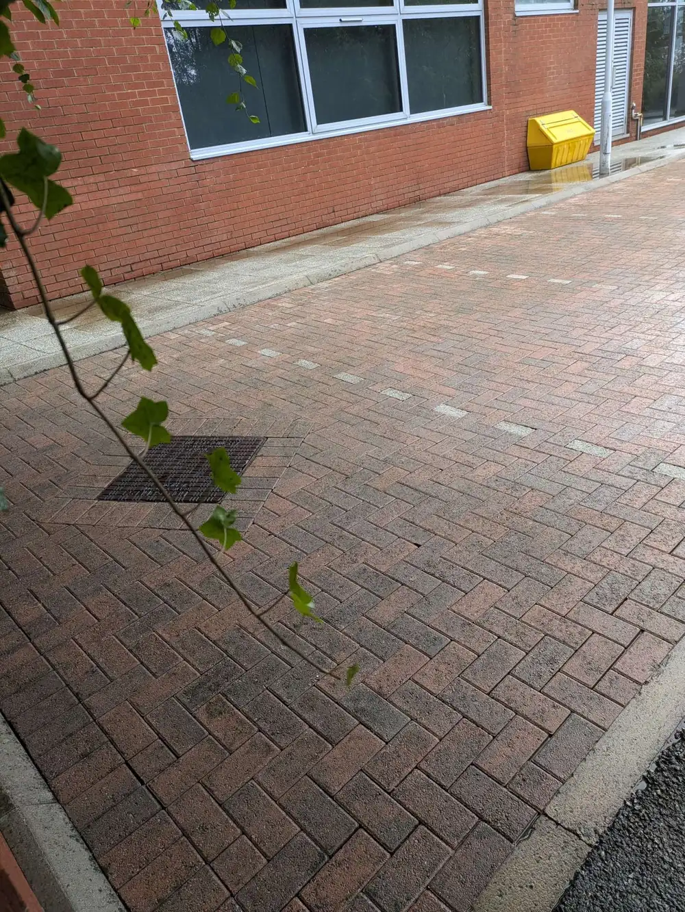 The same block paving and drainage after cleaning