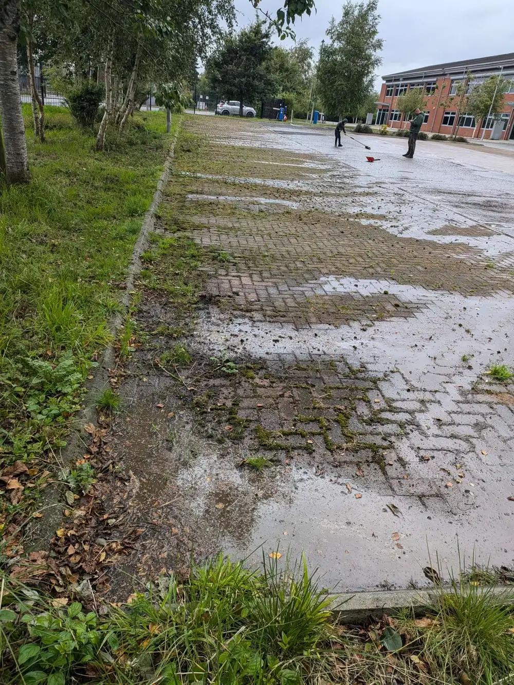 Commercial kerbs and hard standing weathered before cleaning