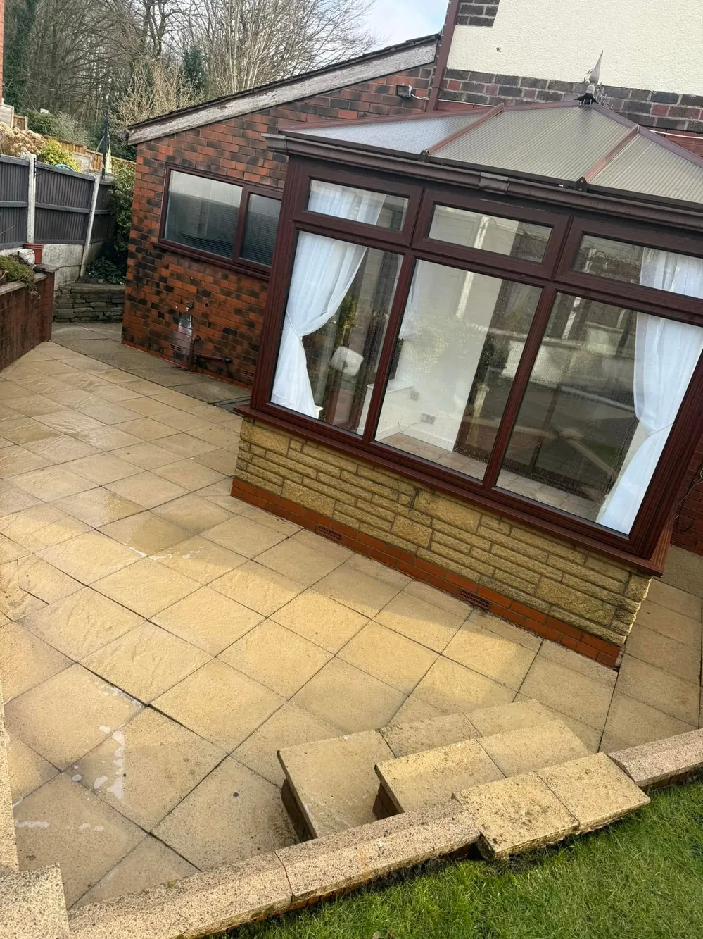 The same conservatory and patio after cleaning, uPVC bright again