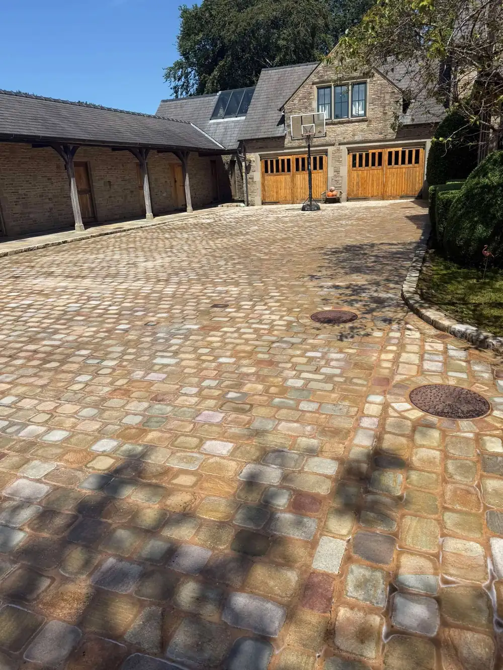 The same stone setts courtyard after pressure washing